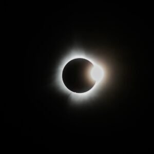Capture of a breathtaking solar eclipse showcasing the sun's corona and lunar silhouette.